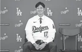  ?? ASHLEY LANDIS/AP ?? The Dodgers' Shohei Ohtani answers questions during a news conference at Dodger Stadium on Dec. 14 in Los Angeles.