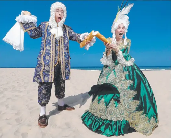  ?? Picture: RICHARD GOSLING ?? Marc Dupont and Annie Lowe get into charcater ahead of the Bonjour French Festival at Broadbeach.