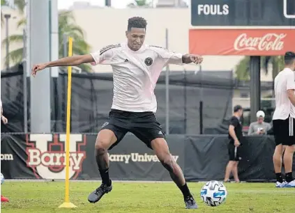 ?? JOE CAVARETTA/SUN SENTINEL ?? Colombian striker Juan Agudelo works during the first training session for David Beckham’s Inter Miami MLS team Monday at Barry University.
