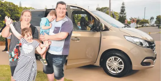  ?? JOYOUS TIME: James and Erin Peach with the kids, Luke 3, and Molly 8. They were thrilled with the new LDV G10 van. ABOVE: Erin Peach is overcome with emotion as the gift is presented to the family. Picture: ALIX SWEENEY ??