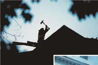  ?? STAFF PHOTOS BY MATT STONE ?? BATTLE RAGES: A Boston firefighte­r uses an ax, above, while two others access a window, right, at the Evelyn Street fire.