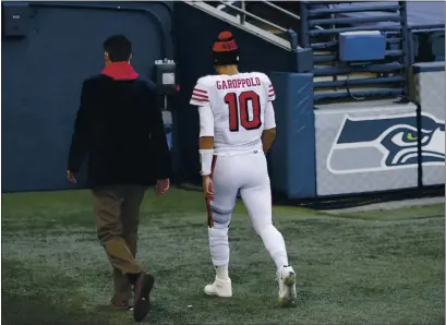  ?? SCOTT EKLUND — THE ASSOCIATED PRESS FILE ?? San Francisco 49ers quarterbac­k Jimmy Garoppolo (10) walks to the locker room during the second half against the Seattle Seahawks on Nov. 1, 2020, in Seattle.