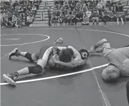  ?? Photo by Josh Marble ?? PIN— JJ Marble pins an opponent at the Grizzly Shakedown.