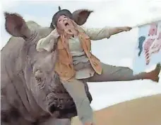 ?? KIA ?? Melissa McCarthy, in a save-the-world role in a Kia ad, has an unhappy encounter with a rhinoceros.
