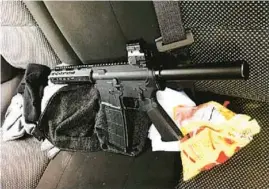  ?? U.S ATTORNEYS OFFICE ?? A criminal complaint alleged this semi-automatic assault pistol was part of the payment in a murder-for-hire plot that led to the execution-style slayings of a suspected police informant and his girlfriend in 2018.