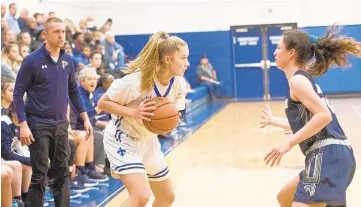  ?? JOSHUA MCKERROW/CAPITAL GAZETTE ?? Whitney Albert of St. Mary's looks for a way around Severna Park's Lena McLaughlin during Thursday's game. The Falcons defeated the Saints, 38-31.