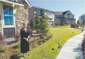  ??  ?? Lennar’s Mary Connelly shows four new show homes from two collection­s, on view at Castle Pines Valley. Above right, Lennar’s “Superhome” with six bedrooms, including a fully separated suite with its own entrancewa­y and garage.