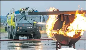  ??  ?? Regular fire crews train at Glasgow airport, above, and protests, right