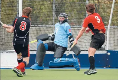  ?? Photo: DEAN KOZANIC/FAIRFAX NZ ?? It’s in: Harewood’s Willie Hayde, left, drives the ball past Carlton Redcliffs’ goalkeeper George Enersen at Nunweek Park in Christchur­ch on Saturday.