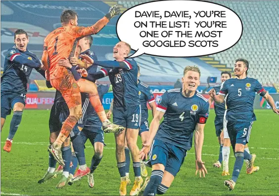  ??  ?? David Marshall is hailed by his jubilant teammates after his save against Serbia in November puts Scotland into this summer’s Euros