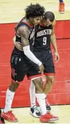  ?? Jon Shapley / Staff photograph­er ?? Rockets guard Kevin Porter Jr., left, injured his left ankle in the third quarter during Wednesday’s loss.