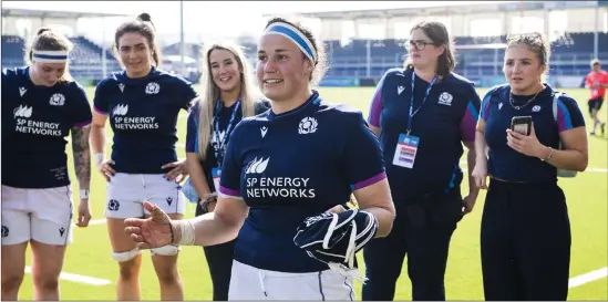  ?? ?? Scotland captain Rachel Malcolm, centre, was thrilled with the announceme­nt of a support package from Scottish Rugby