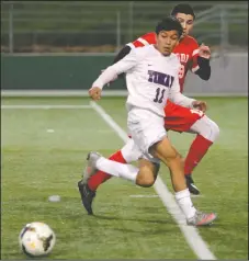  ?? DAVID WITTE/NEWS-SENTINEL ?? Tokay's Ivan Rosales (11) positions himself for the pass in front of Lodi defender Carlos Rodriguez. Rosales scored all three of Tokay’s goals.