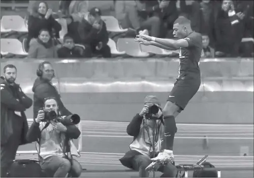  ?? Photo: AFP ?? Paris Saint-Germain forward Kylian Mbappe celebrates after scoring his second goal during the match against Monaco at the Louis II Stadium in Monaco on Wednesday.