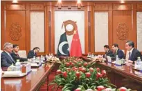  ?? - Madoka Ikegami/Pool via Reuters ?? ENGROSSED: Pakistan’s Foreign Minister Khawaja Muhammad Asif,left, and Chinese State Councilor and Foreign Minister Wang Yi, right, have a meeting at the Diaoyutai State Guest House in Beijing, China, April 23, 2018.