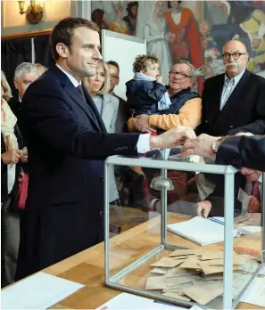  ?? PICTURE: REUTERS ?? HOPEFUL: Emmanuel Macron, head of the political movement En Marche!, or Onwards!, and candidate for the 2017 French presidenti­al election, casts his ballot on Sunday.