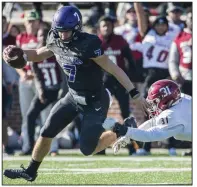  ?? (Arkansas Democrat-Gazette file photo) ?? Ouachita Baptist quarterbac­k Brayden Brazeal (left) avoids a sack attempt made by Henderson State defensive back Mercado Anderson during last year’s Battle of the Ravine. The GAC announced Friday it will delay the start of all sports practices until Aug. 31 and postpone any athletic competitio­ns until Sept. 28.