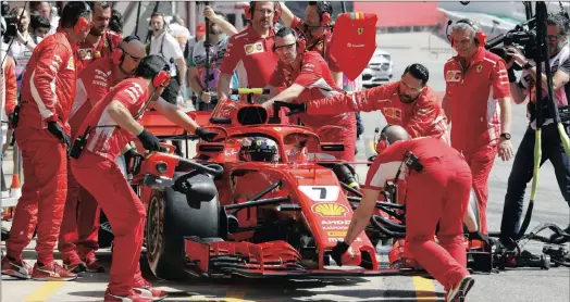  ?? PICTURE: EPA-EFE ?? TECHNO LOOK: Finnish Formula One driver Kimi Raikkonen of Ferrari at the team’s garage during the free practice session at the Circuit de Barcelona-Catalunya. Ferrari has reposition­ed the mirrors to the halo protection device.