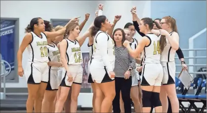  ?? Steven Eckhoff ?? The Pepperell Lady Dragons huddle during a timeout Wednesday in the opening round of the region tournament at Armuchee High.