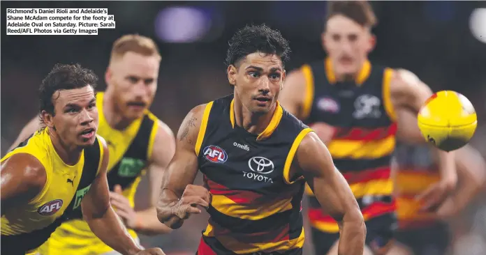  ?? ?? Richmond’s Daniel Rioli and Adelaide’s Shane McAdam compete for the footy at Adelaide Oval on Saturday. Picture: Sarah Reed/AFL Photos via Getty Images