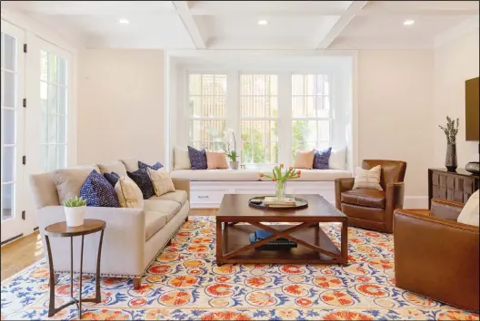  ??  ?? This undated photo shows a room design by designer Jessica Wachtel. If you’re seeking to brighten up a room during the dark winter months, Wachtel suggests adding a patterned rug
in light and bright colors, as she did in this Bethesda, Md, living room. (AP)