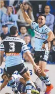  ??  ?? Sharks winger Valentine Holmes celebrates his try.
From back page