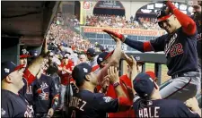  ?? MATT SLOCUM — THE ASSOCIATED PRESS ?? Washington’s Juan Soto celebrates in the dugout after his home run against the Houston Astros during the fourth inning of Game 1of the World Series Tuesday in Houston. For updated info, go to delcotimes.com.