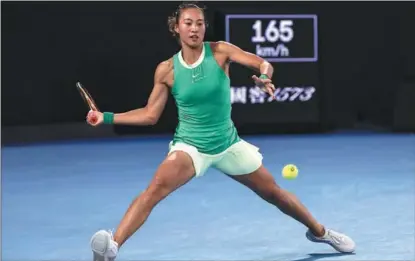  ?? AFP ?? China’s Zheng Qinwen tees up a return to Belarusian Aryna Sabalenka during the women’s singles final of the Australian Open in Melbourne, Australia, on Jan 27.