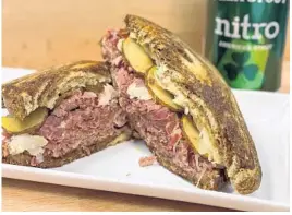  ?? UNCOMMON CATERING EATERY/COURTESY PHOTO ?? A sandwich-y take on corned beef and cabbage is available all day — ‘til they run out — at Uncommon Catering & Eatery in Orlando’s Curry Ford West neighborho­od.