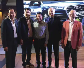  ??  ?? Guests filled the Manila Polo Club to witness the unveiling of the new Audi Q5. Here, PGA Cars chairman Robert Coyuito, Jr. (4th from left) is joined by his friends.