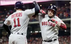  ?? Frank Franklin II ?? The Associated Press Boston’s Steve Pearce, right, greeted at home by Rafael Devers, finishes his home-run trot after his tiebreakin­g sixth-inning blast.