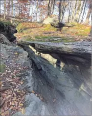  ?? Christina Forristall / Contribute­d photo ?? Fat Man’s Squeeze, a rock formation with fissures and crevices that is a favorite for climbing at Deer Lake Camp.