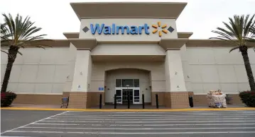  ??  ?? WALMART OPERATES over 11,700 stores worldwide, like this Supercente­r in Encinitas, California.