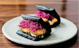  ?? [PHOTO PROVIDED BY PAGU] ?? This Pagy squid ink oyster bao is by chef Matt Li.