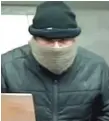  ?? | FBI ?? Surveillan­ce image of themanwho robbed a Bank of America branch Thursday at 6665 N. Northwest Highway. Daniel Torres has since been charged with the robbery.