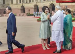  ?? — PTI ?? President Ram Nath Kovind, his wife Savita and Prime Minister Narendra Modi greet Kim Jung- sook, the wife of South Korean President Moon Jae- in, during a ceremonial reception at Rashtrapat­i Bhavan in New Delhi on Tuesday.