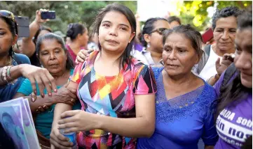  ??  ?? Imelda reacts as she leaves a court of law after being acquitted of attempted aggravated murder under the country’s abortion law, in Usulutan. — Reuters photo