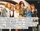  ??  ?? In this April 6, 1974 file photo, members of Swedish group ABBA and close associates celebrate the victory of their song ‘Waterloo’ in the Eurovision Song Contest in Brighton, England.