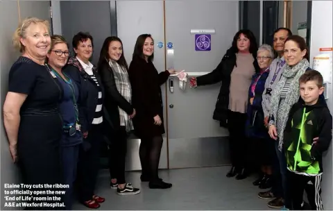  ??  ?? Elaine Troy cuts the ribbon to officially open the new ‘End of Life’ room in the A&E at Wexford Hospital.
