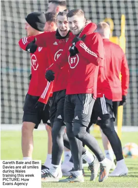  ??  ?? Gareth Bale and Ben Davies are all smiles during Wales training this week PICTURE: Huw Evans Agency