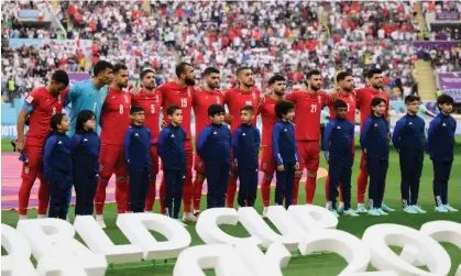  ?? Photograph: Matthias Hangst/Getty Images ?? Iranian players line up silently ahead of their World Cup match against England at Khalifa Internatio­nal stadium in Doha, Qatar, on Monday.