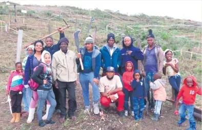  ??  ?? Just a handful of residents of the Lankgewag community in Smutsville, Sedgefield, who were clearing plots upon which to build themselves houses. They say they have waited long enough for Knysna Municipali­ty to build houses. About 110 plots have been...