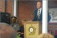  ?? BILL RETTEW JR. – DIGITAL FIRST MEDIA ?? District Attorney Tom Hogan salutes law enforcemen­t officers, and their families, who made the ultimate sacrifice.