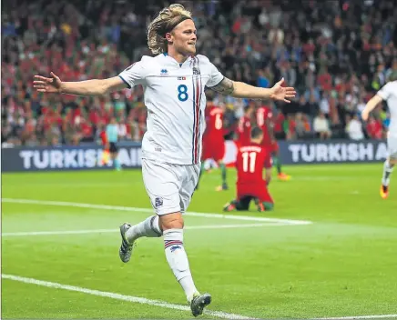  ??  ?? GOING TO A NEW LEVEL: Birkir Bjarnason celebrates his goal for Iceland against Ronaldo’s Portugal