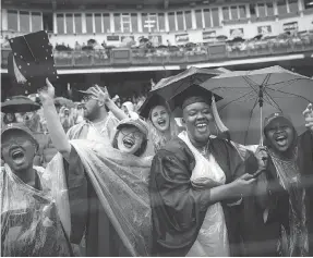  ??  ?? Graduating New York University students gave Prime Minister Justin Trudeau a warm welcome in a rainy Yankee Stadium.