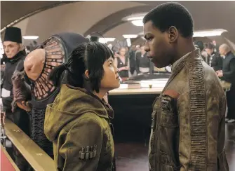  ??  ?? Kelly Marie Tran and John Boyega in Star Wars: The Last Jedi. Tran says Boyega has been a big help in teaching her the ropes.