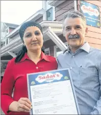  ?? MITCH MACDONALD/THE GUARDIAN ?? Said, right, and Sara Sadat stand outside their new restaurant at 223 University Ave. during their opening Wednesday night. After being forced out of their previous Grafton Street location and worrying whether they could continue the restaurant, the...