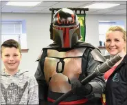  ??  ?? Matthew and Kristy Brown pose with the Mandaloria­n at Boyertown Community Library’s first Library Comic Con.