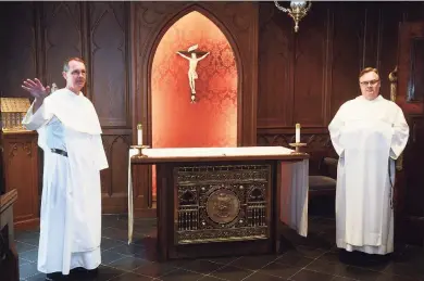  ?? Ned Gerard / Hearst Connecticu­t Media ?? The Rev. John Paul Walker, left, pastor of St. Mary Church, and the Rev. Jordan Lenaghan in the chapel inside the priory at St. Mary’s in New Haven on Thursday. At top, the exterior of the priory at St. Mary Church.