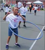  ?? PHOTO BY MICHILEA PATTERSON — FOR MEDIANEWS GROUP ?? At right: People hula hoop at a local neighborho­od park in Pottstown. This photo was taken before the COVID-19 pandemic.